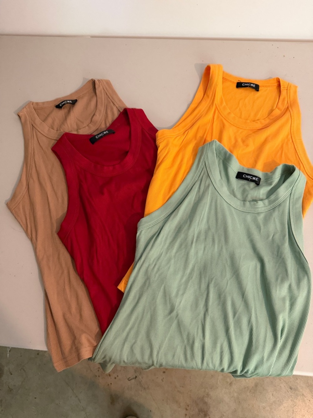 NWOT Four racorback tops by chic me, size large. One price for four